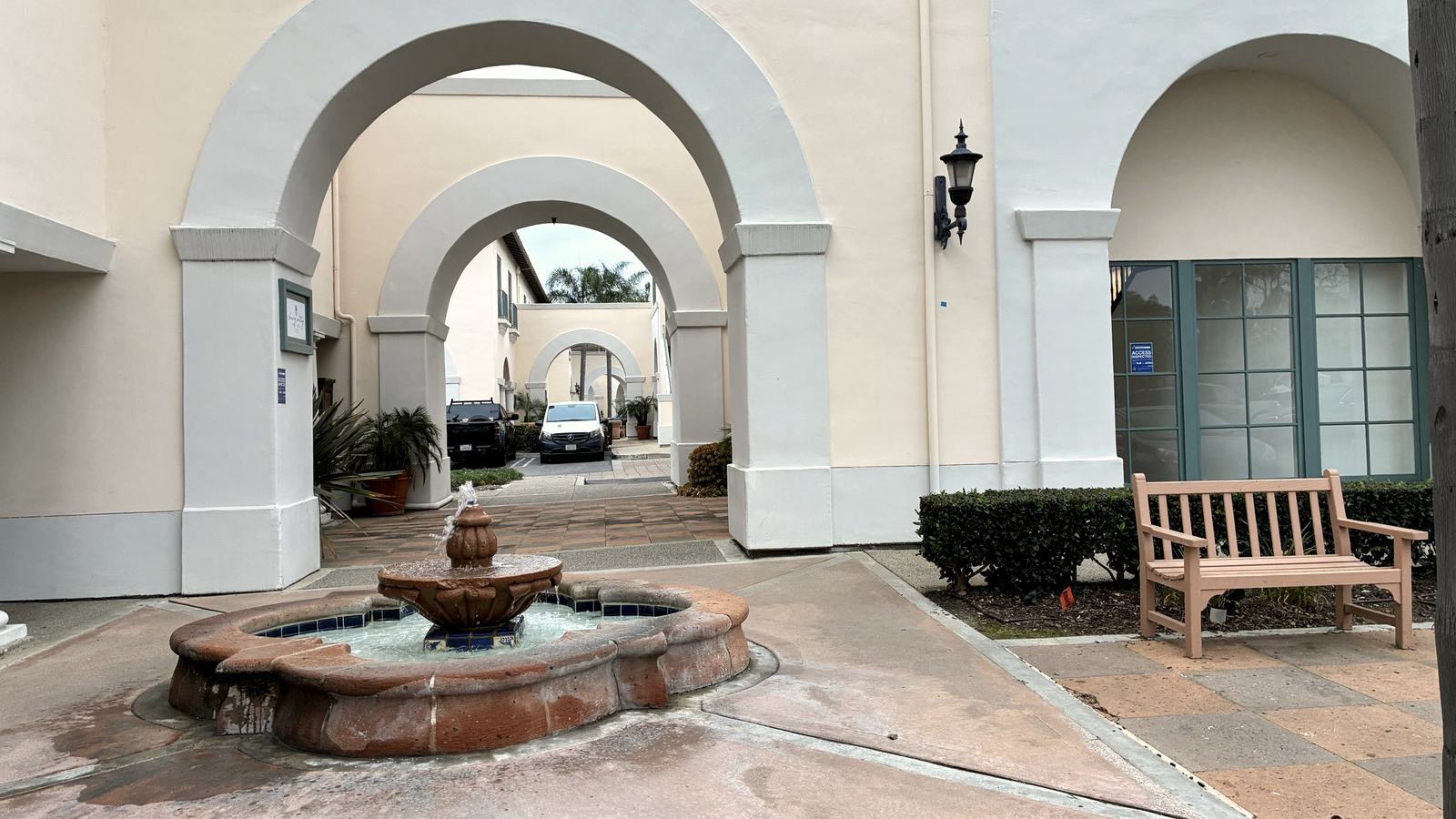 Spanish-style courtyard and fountain outside The Natural Path clinic