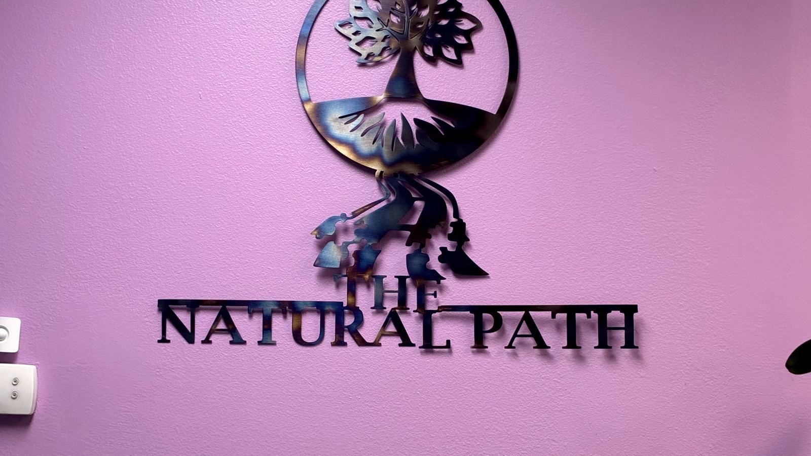 The Natural Path logo displayed in the clinic